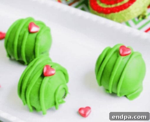 Grinchmas Dessert Delights 29 Grinch Oreo Truffle Dessert, green with red sprinkles.