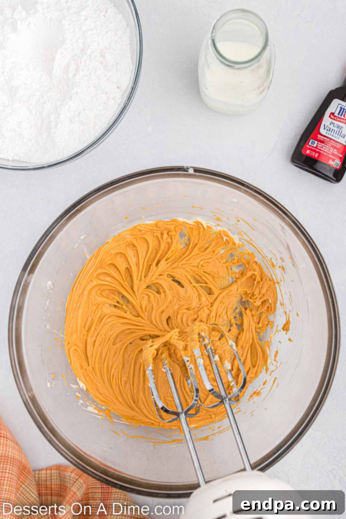 Butterscotch Bliss Cake 7 Melted butterscotch chips in a microwave-safe bowl, ready for frosting preparation.