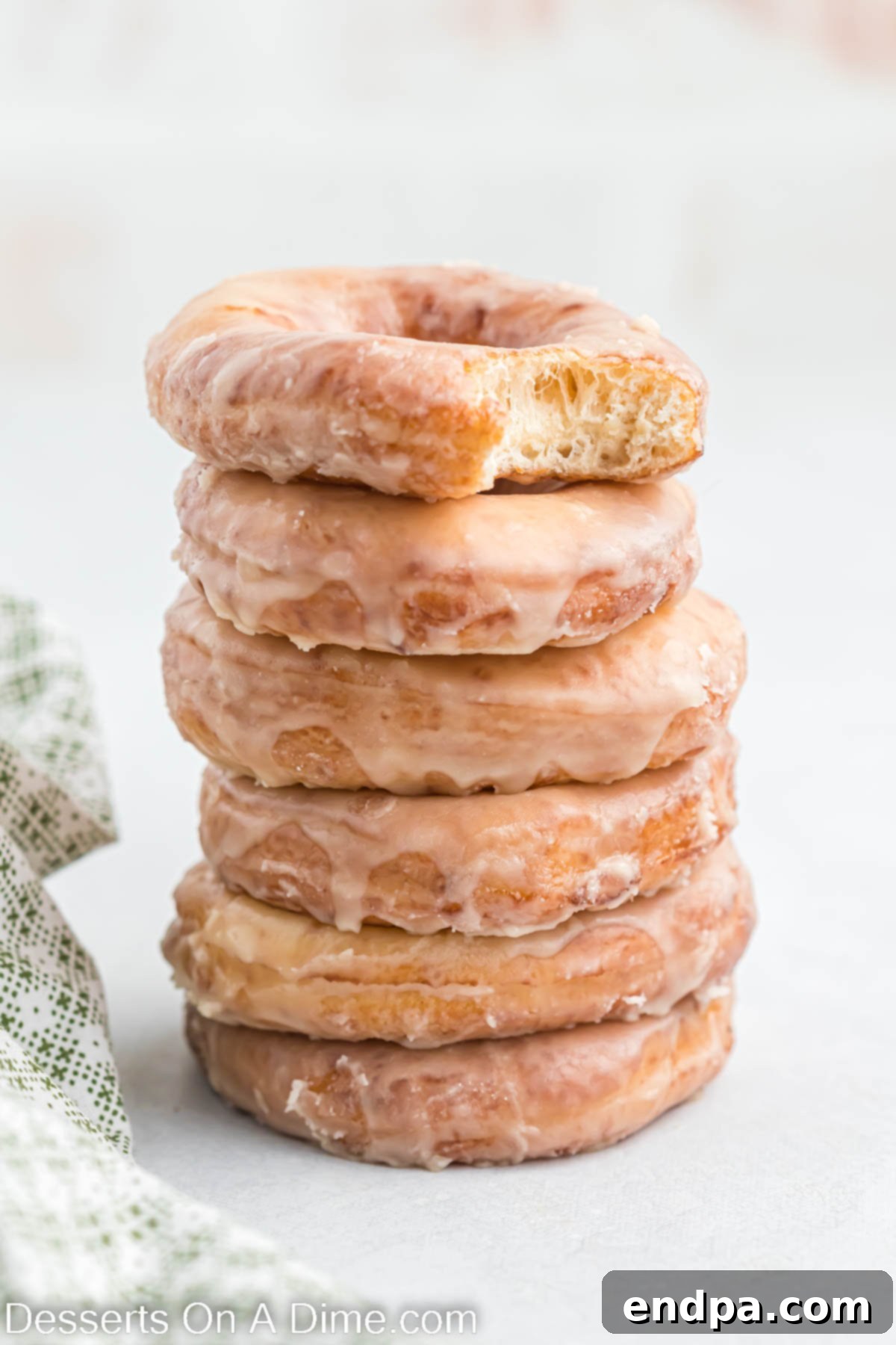 Krispy Kreme Donuts stacked together.