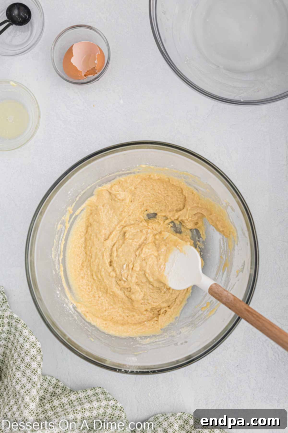 Dough combined together in a mixing bowl.