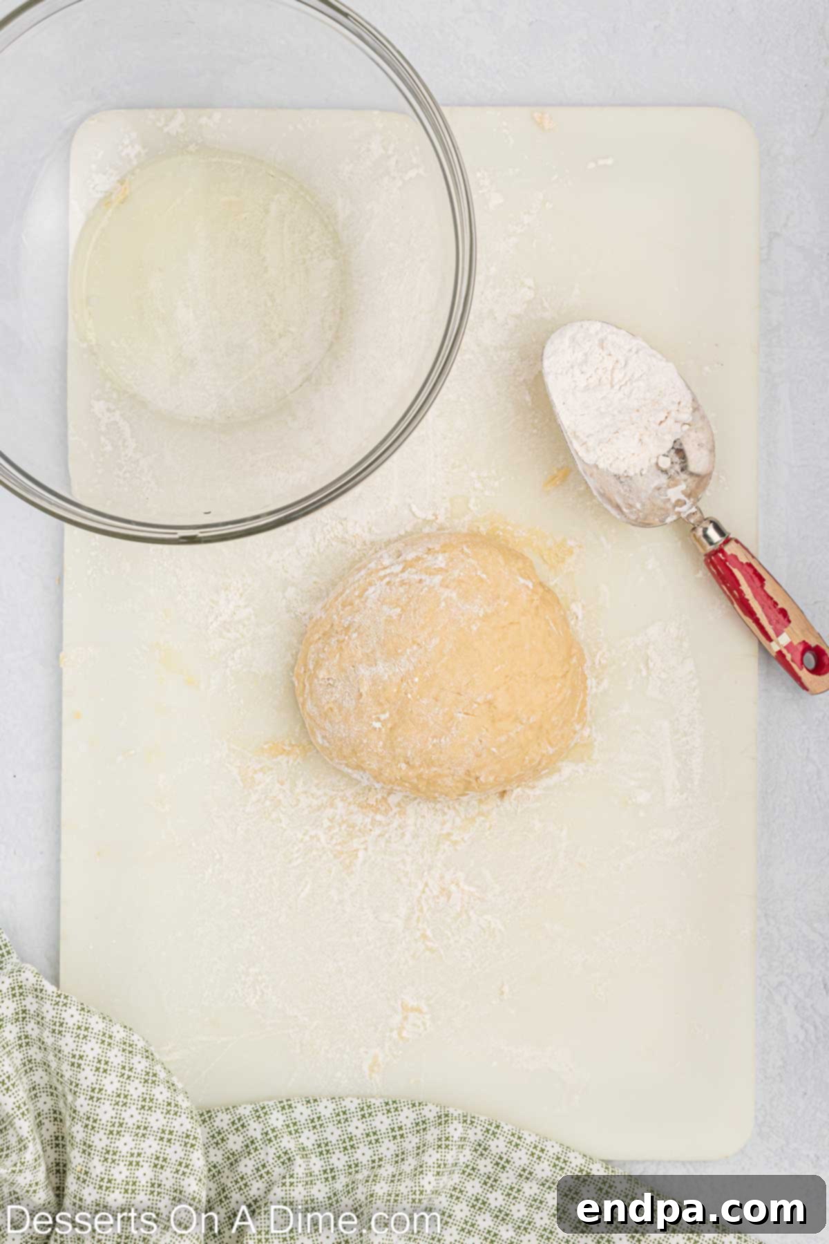 Dough kneaded together on a floured surface.