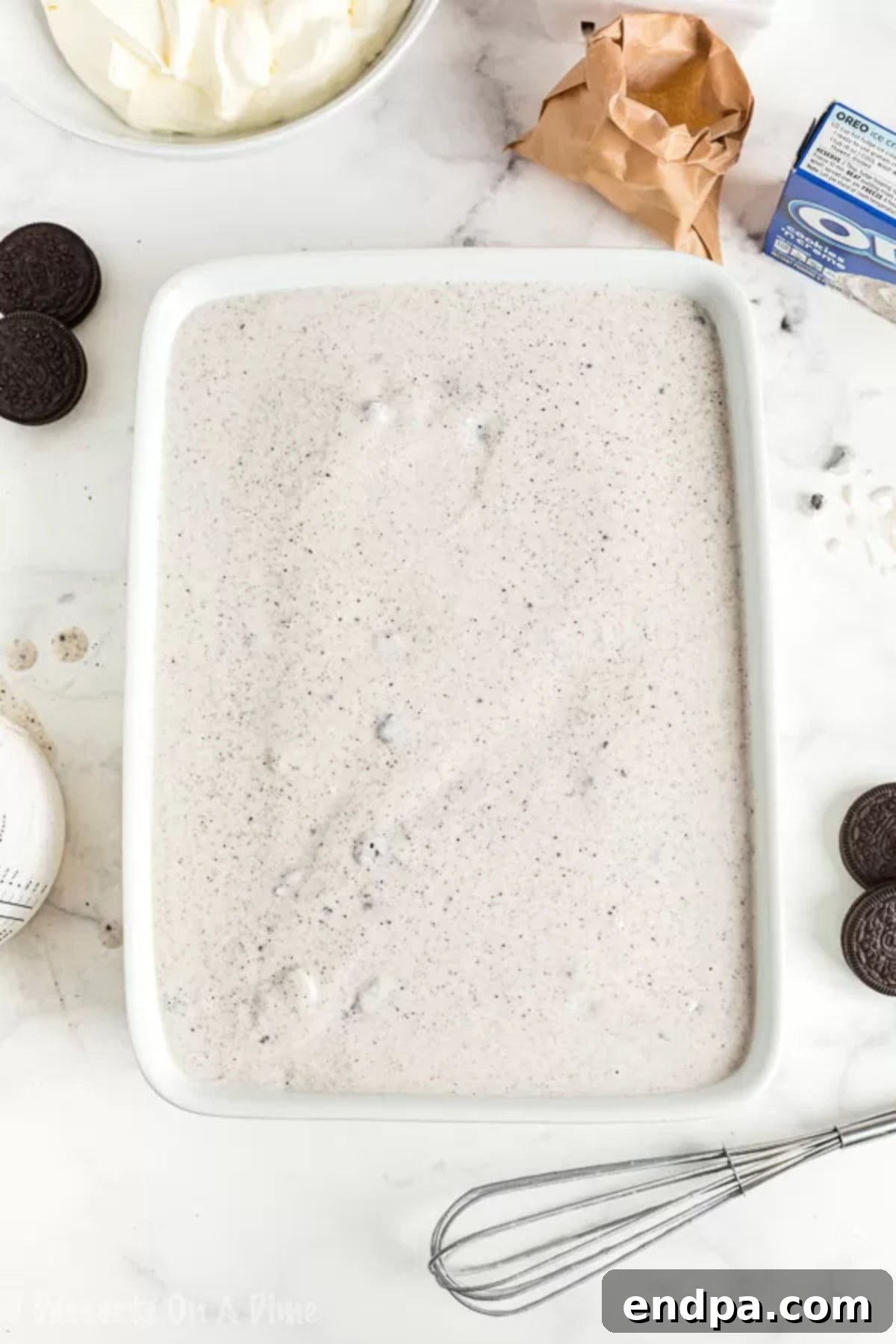 Mixture spread on cake. 