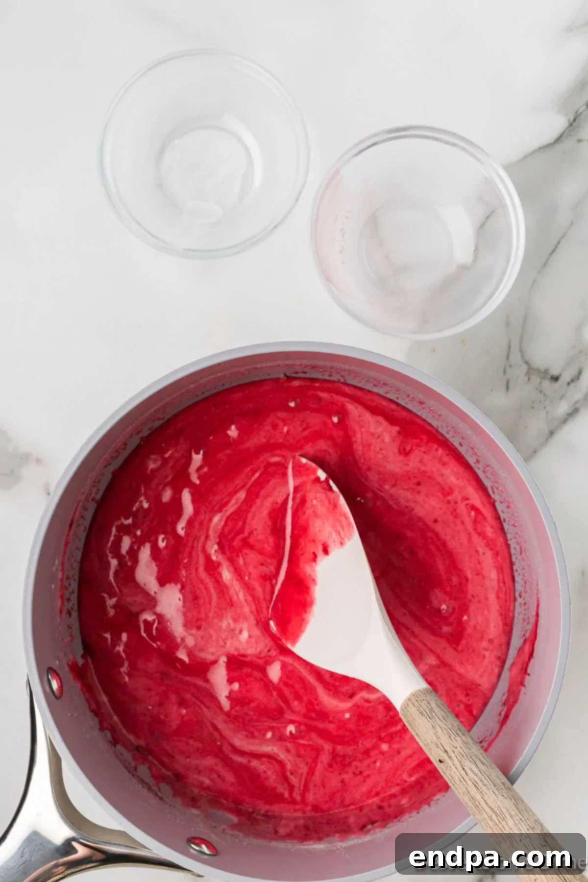 The Kool-Aid mixture, now light, fluffy, and expanded, ready to be poured over popcorn.