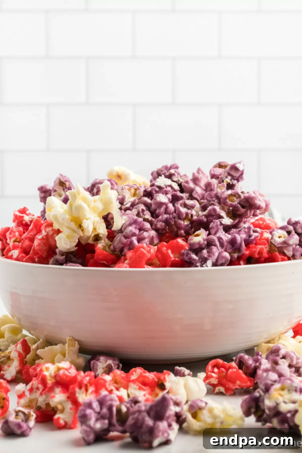 A second bowl of Kool-Aid popcorn, showcasing its vibrant colors and appealing texture.