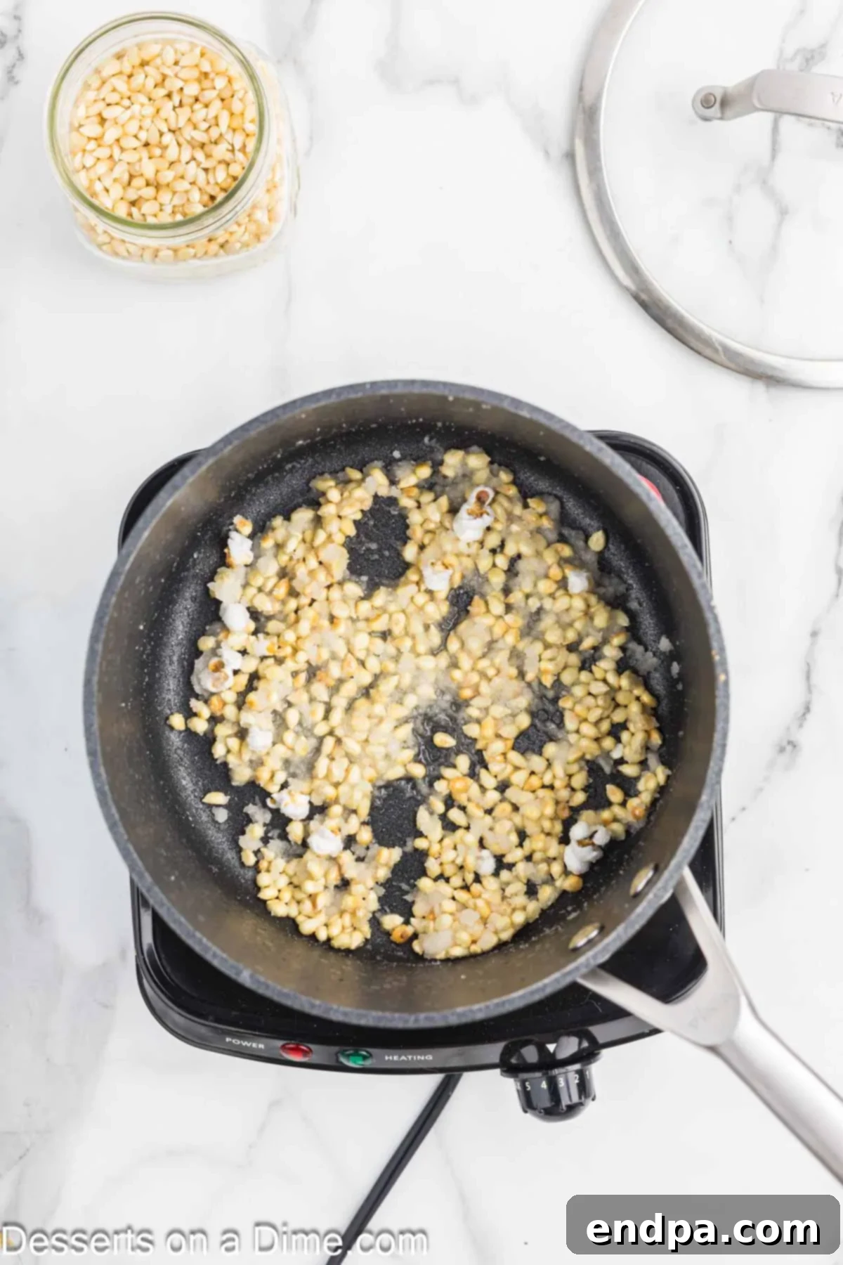 Sweet & Salty Kettle Corn 5 Popcorn kernels, sugar, and salt added to hot oil in a saucepan.