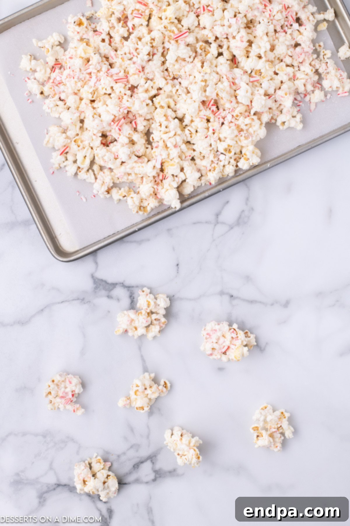 Peppermint Pop Crunch 6 Crushed candy canes sprinkled generously on top of chocolate-coated popcorn.