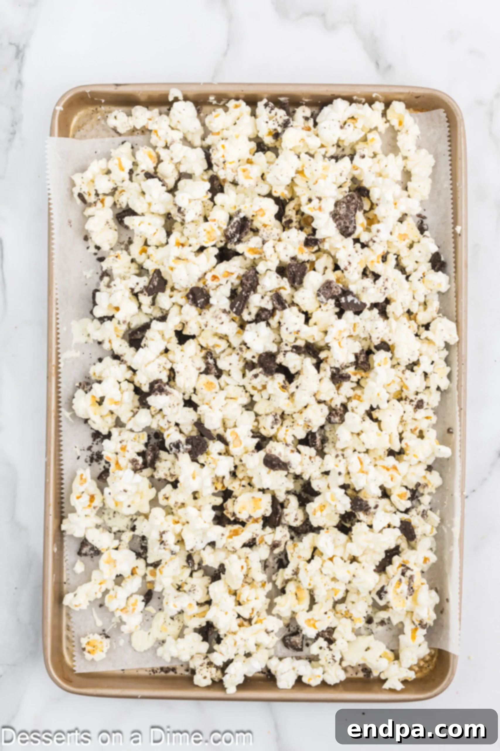 Oreo Popcorn Crunch 8 Cookies sprinkled into popcorn.