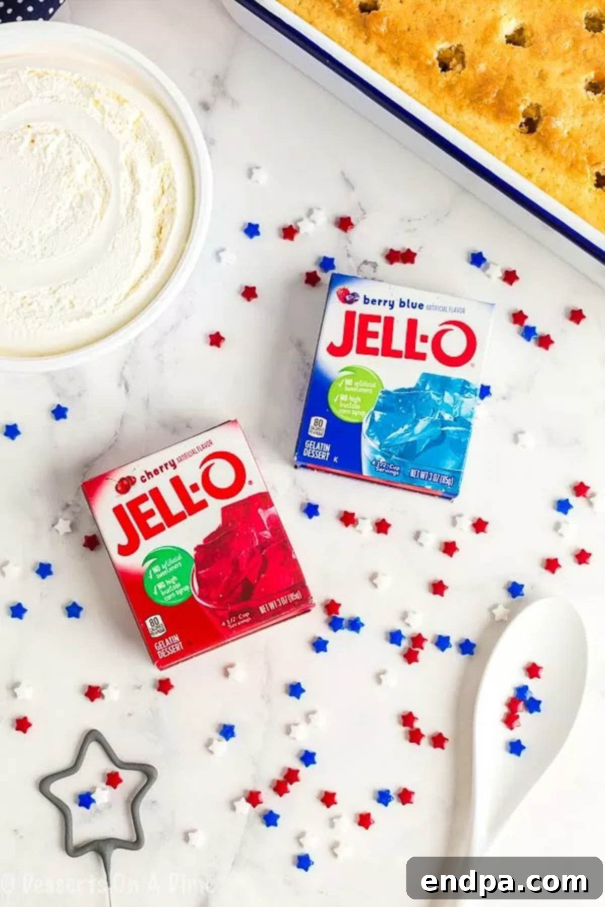 Ingredients for 4th of July Poke Cake: white cake, cool whip, red jello, blue jello, and patriotic sprinkles.