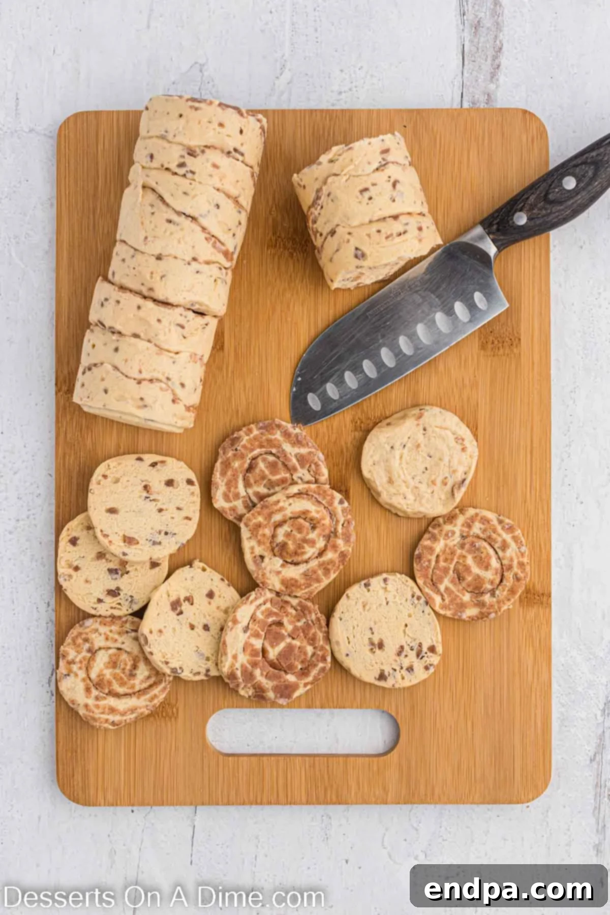 Homemade Cinnamon Roll Pie 4 Cinnamon rolls neatly cut in half, preparing for the pie crust.