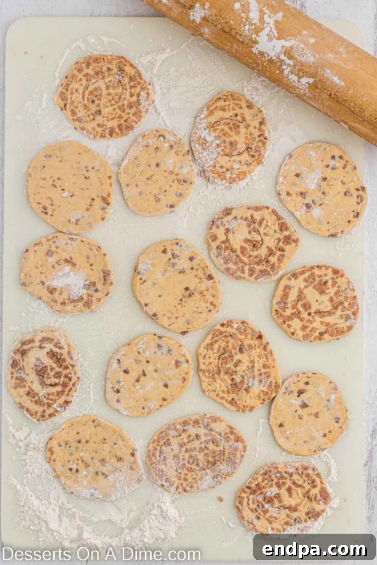 Homemade Cinnamon Roll Pie 5 Thinly flattened cinnamon roll halves, lightly dusted with flour and ready to form the pie crust.
