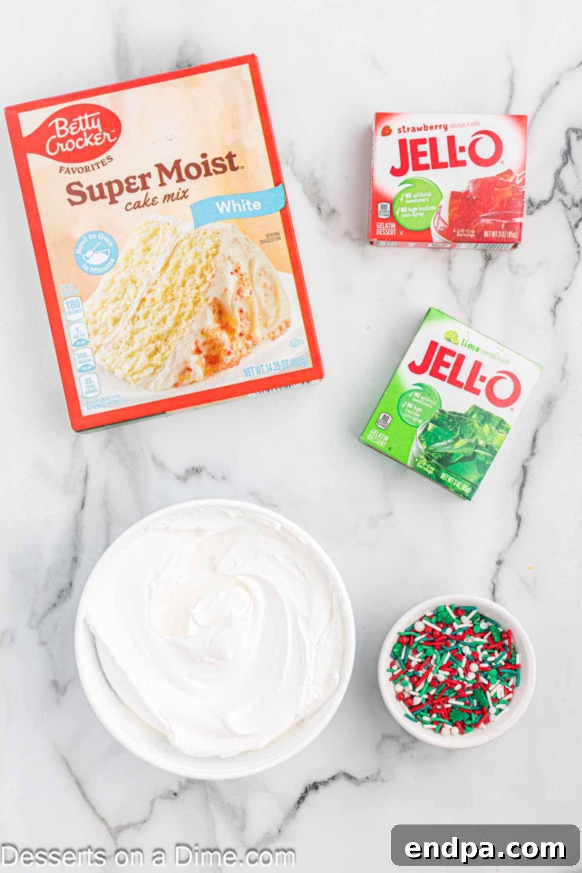 Ingredients for Christmas Poke Cake - white cake mix, red and green jello mix, cool whip, Christmas sprinkles. 