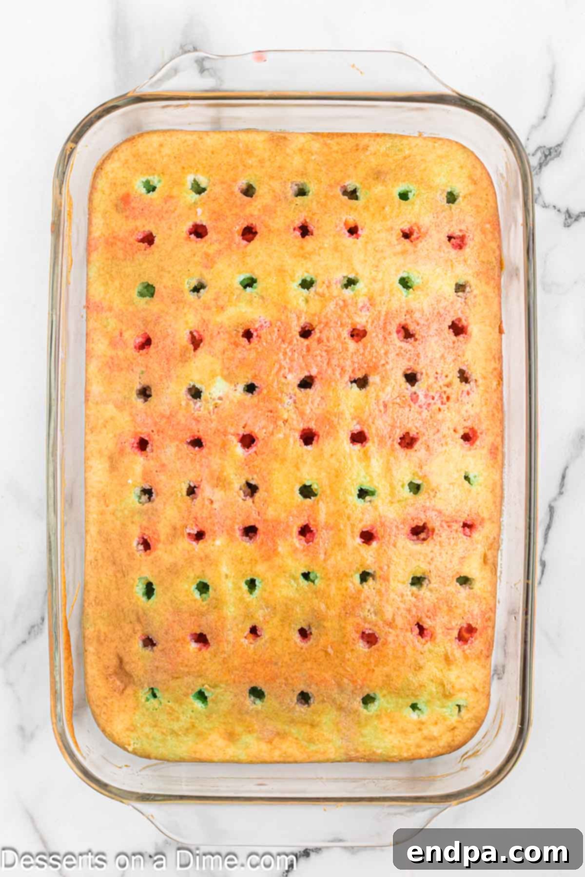 Red Jello alternated with green Jello on cake. 