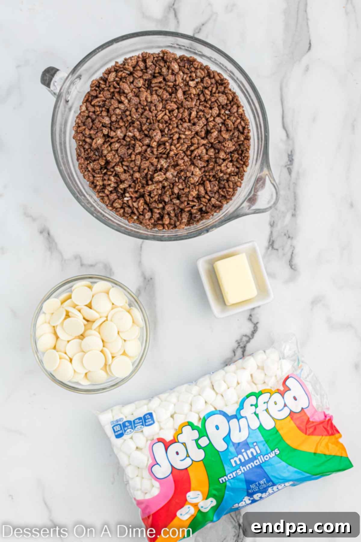 Key ingredients for making Football Rice Krispie treats, including Cocoa Rice Krispies, butter, mini marshmallows, and white chocolate wafers.