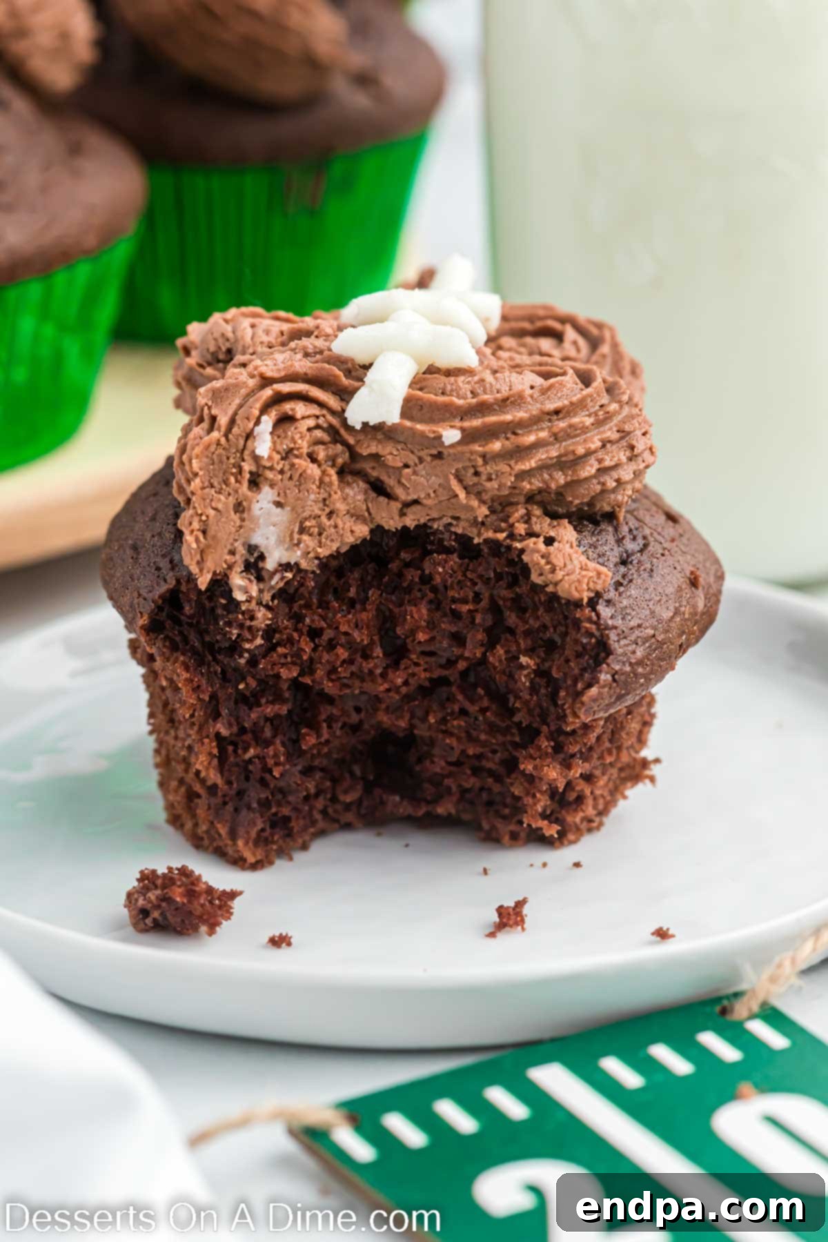 Kick-Off Cupcakes 11 A fully decorated football cupcake served on a plate, ready for enjoyment.