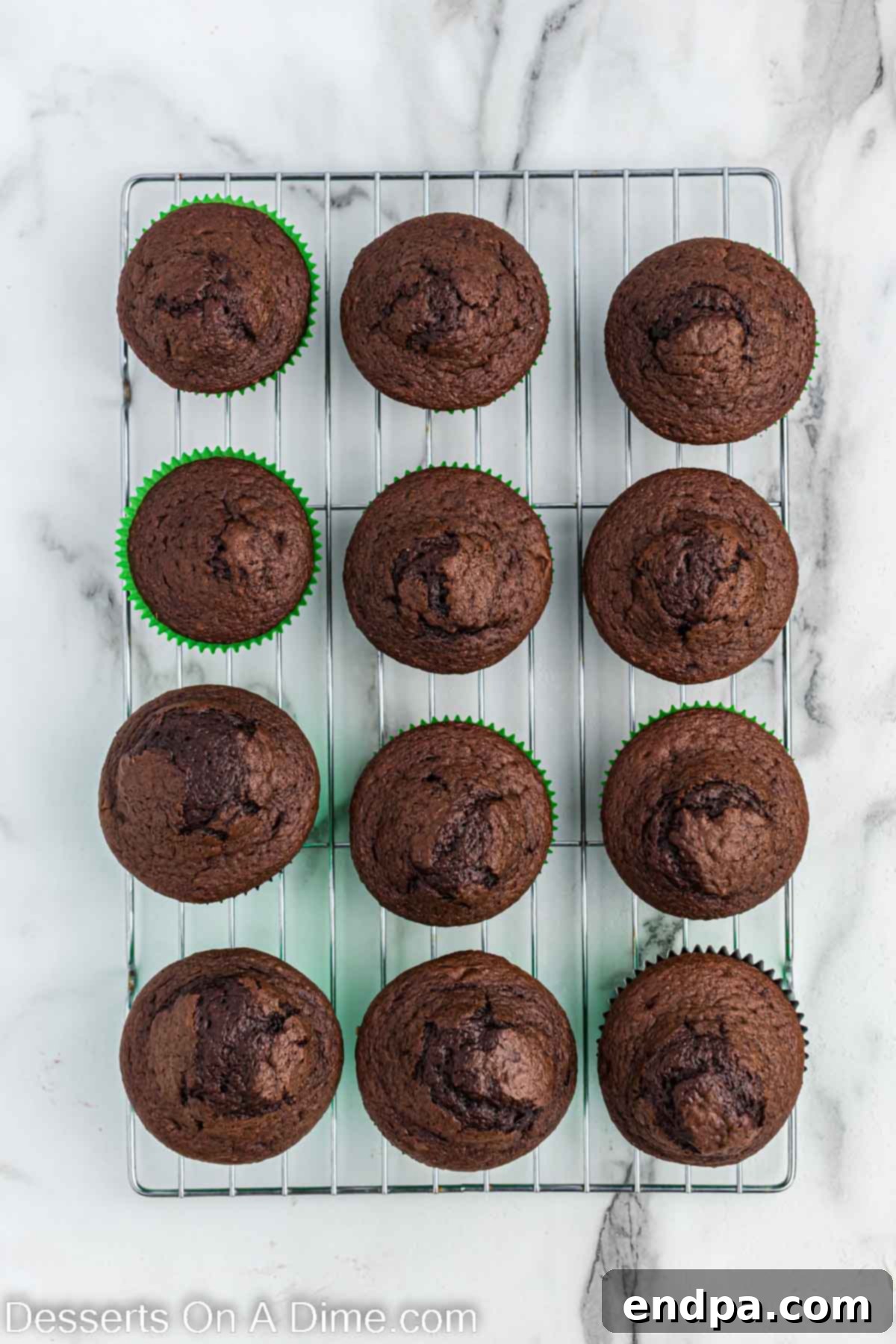 Kick-Off Cupcakes 4 Chocolate cupcakes cooling on a wire rack after baking.