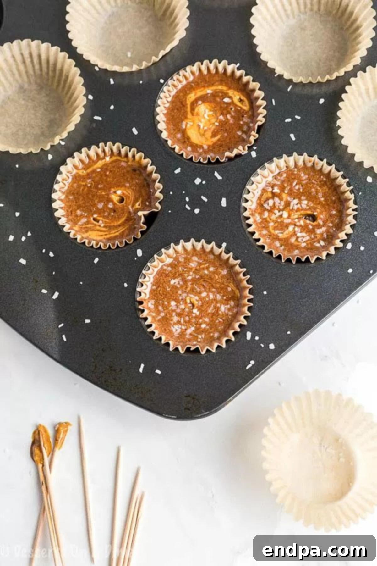 Spoon mixture into mini cupcake tins for easy Keto Chocolate Peanut Butter Fat Bombs