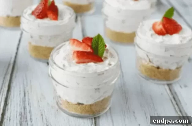 37 Luscious Strawberry Desserts 3 Individual no-bake strawberry cheesecakes in jars.