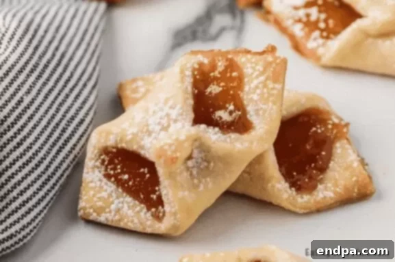 37 Luscious Strawberry Desserts 8 Delicate strawberry pinch cookies on a plate.
