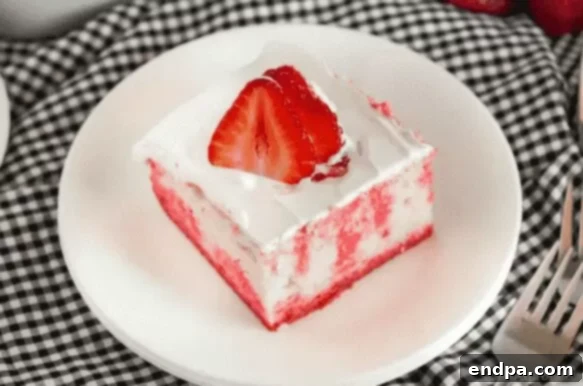 37 Luscious Strawberry Desserts 9 Strawberry Jello poke cake with beautiful pink swirls.