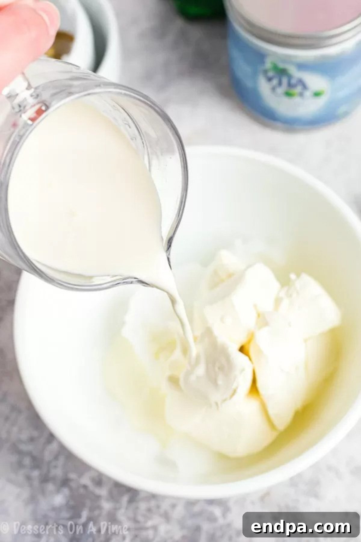 Mixing the ingredients together in a bowl for the keto fat bomb batter, showing a creamy, smooth texture forming, ready for the next step.