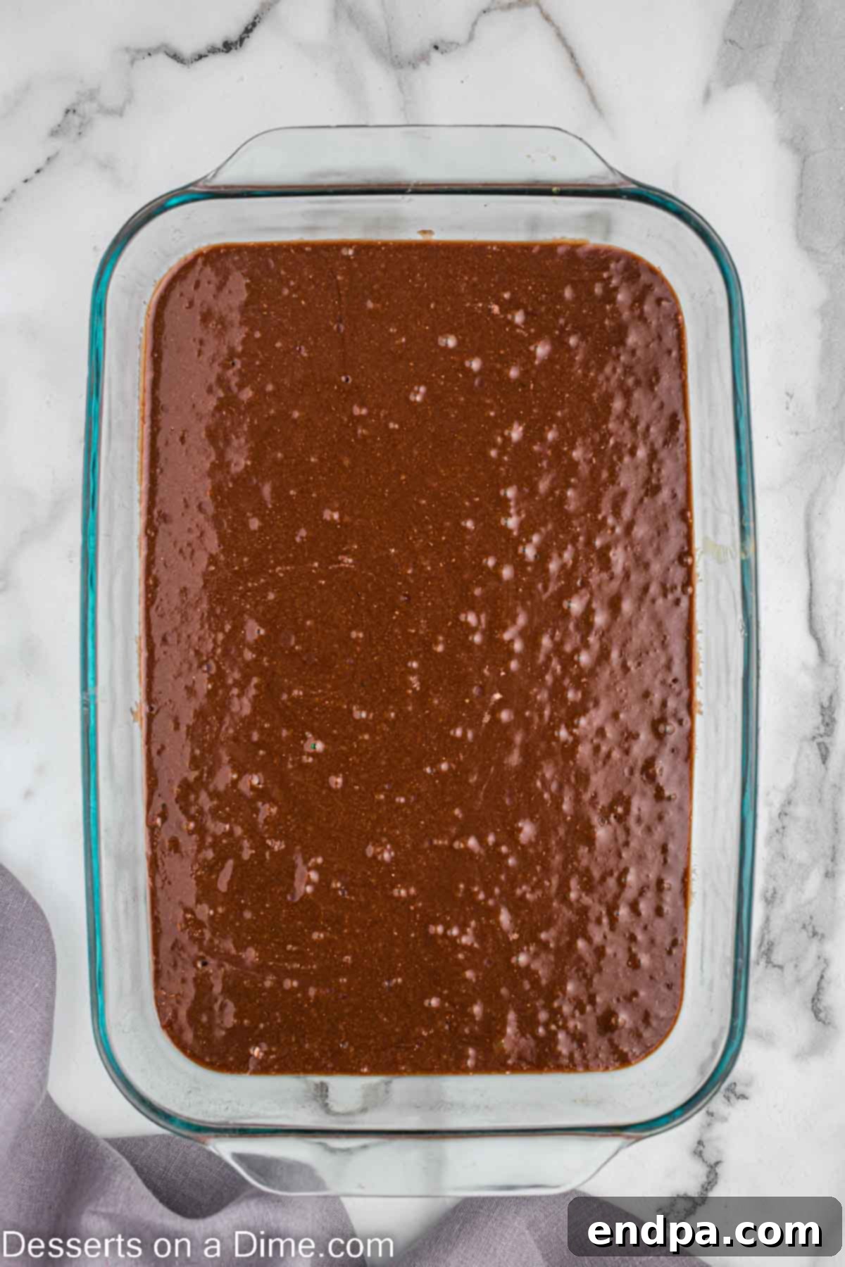 Brownie batter poured into a baking dish