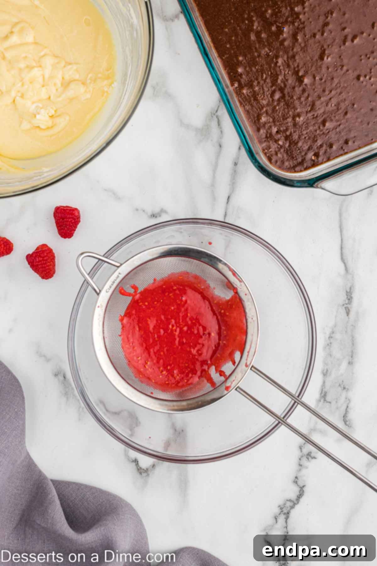 Draining the raspberries in a strainer 