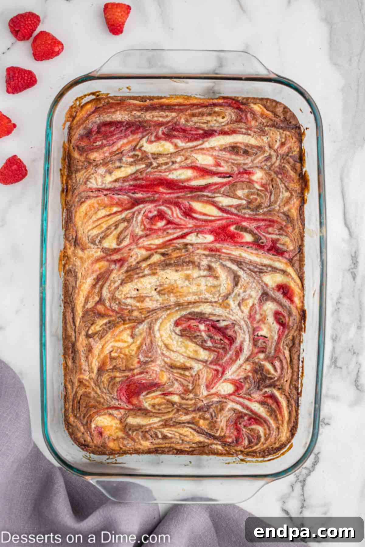 Baked raspberry cheesecake brownie