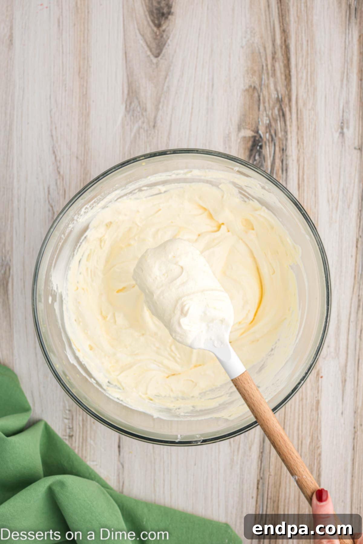 Super Fluffy Cool Whip Frosting 5 The fully combined Cool Whip frosting mixture in a mixing bowl.