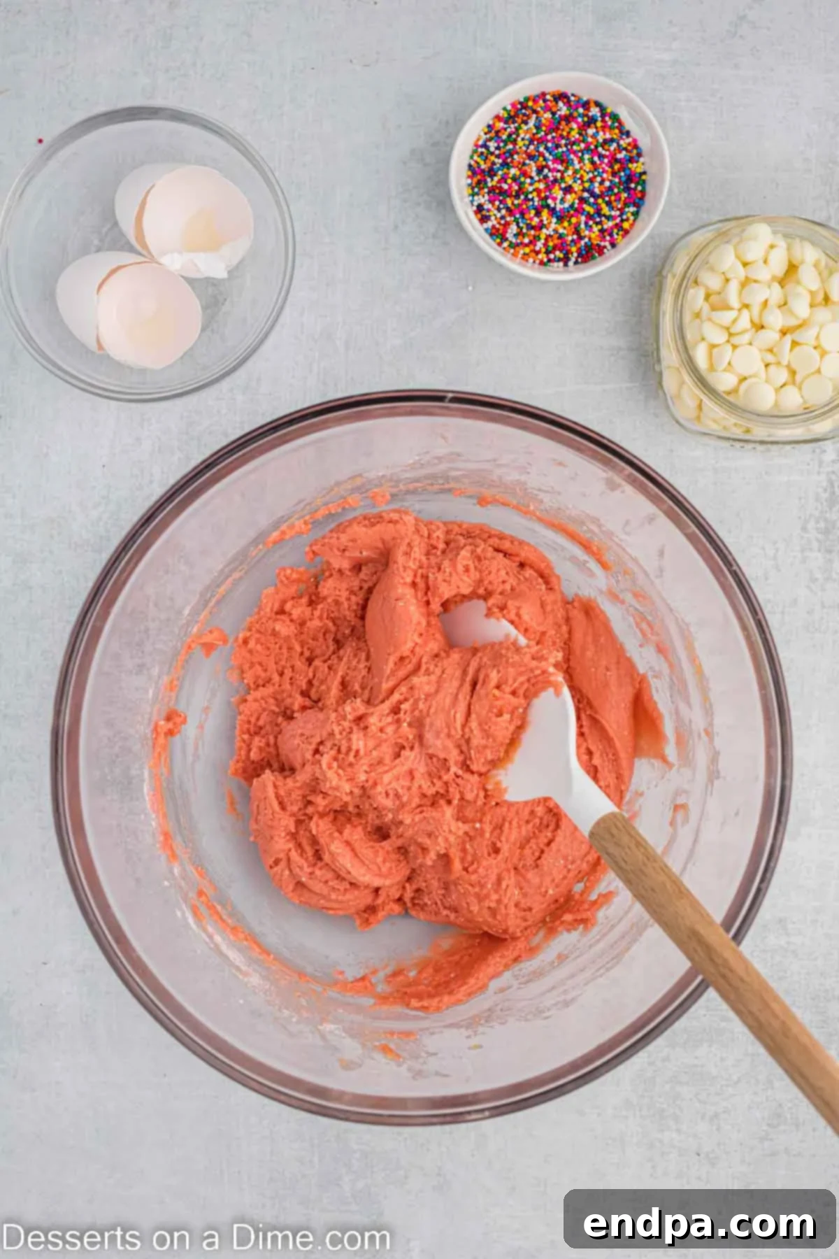 The combined strawberry brownie batter in a bowl, showing its thick consistency.