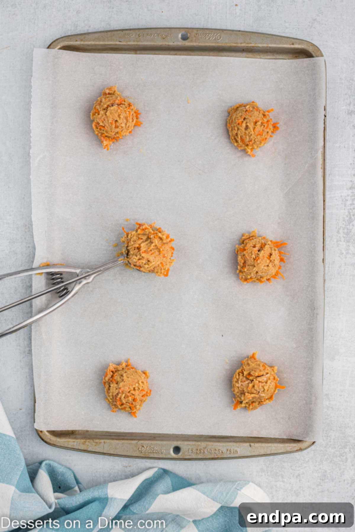 Dough scooped into balls and placed on baking sheet. 