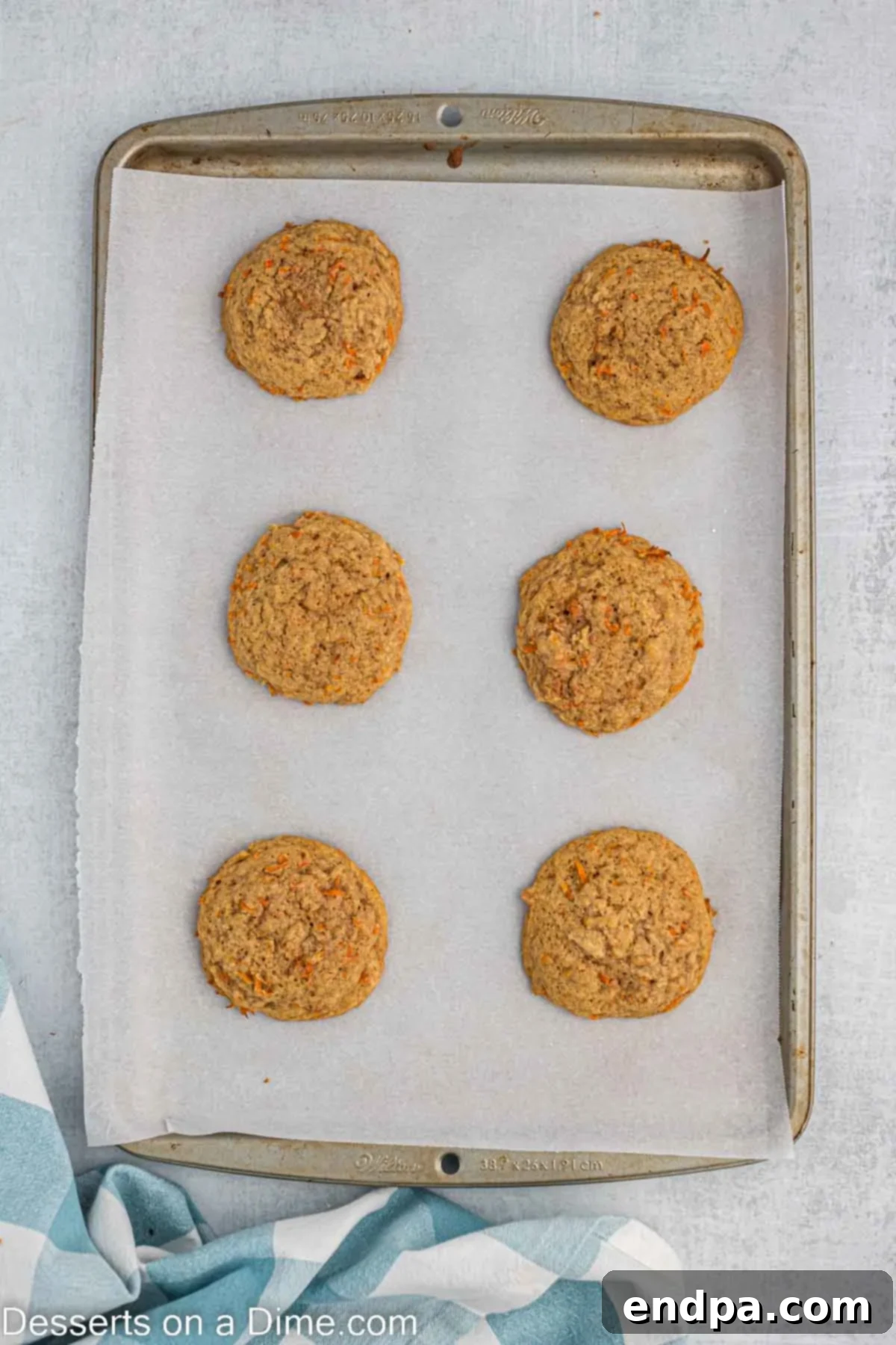 Cookies baked and cooling on baking sheet.