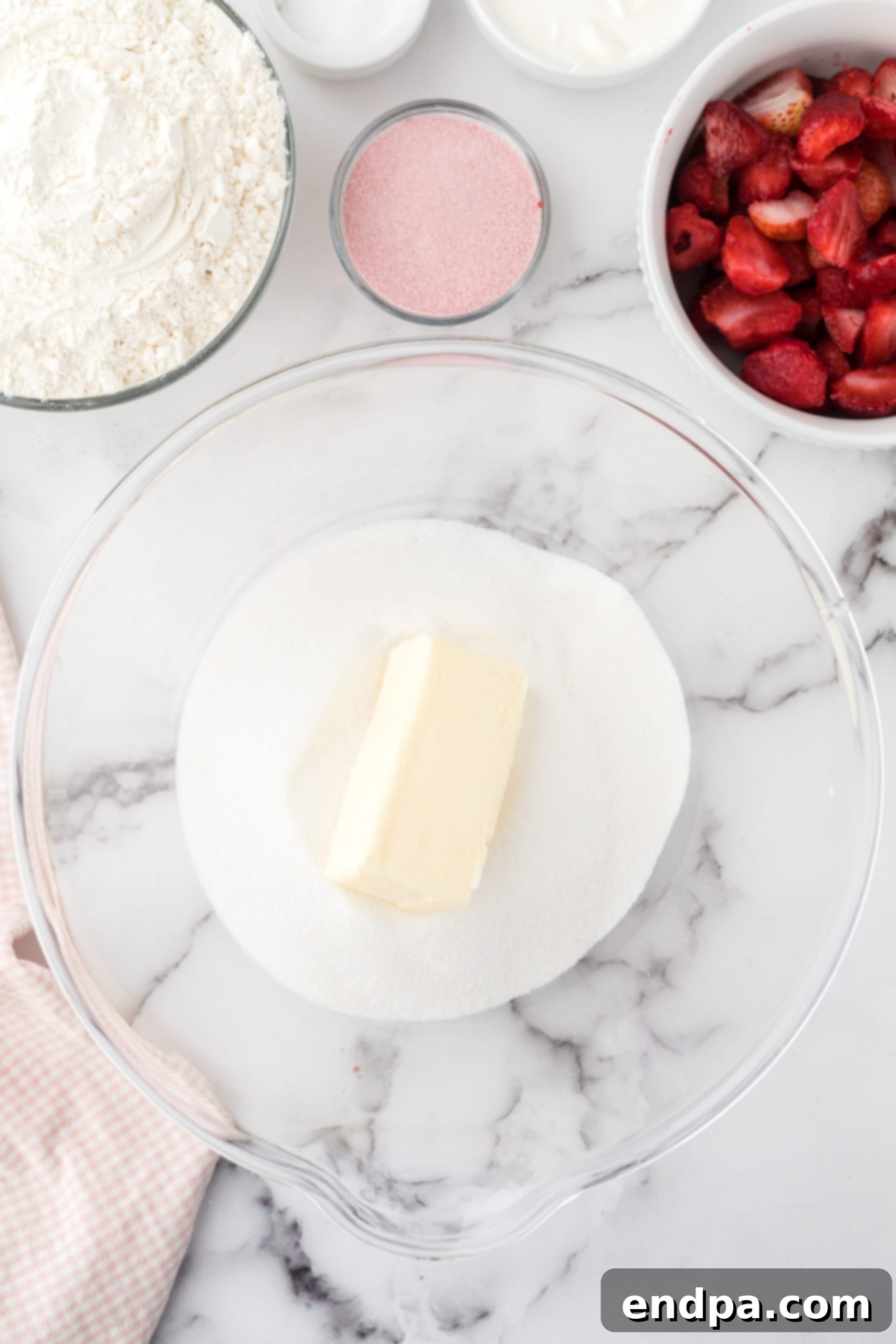 Zesty Strawberry Lemon Bundt Delight 3 Butter and sugar in a mixing bowl.