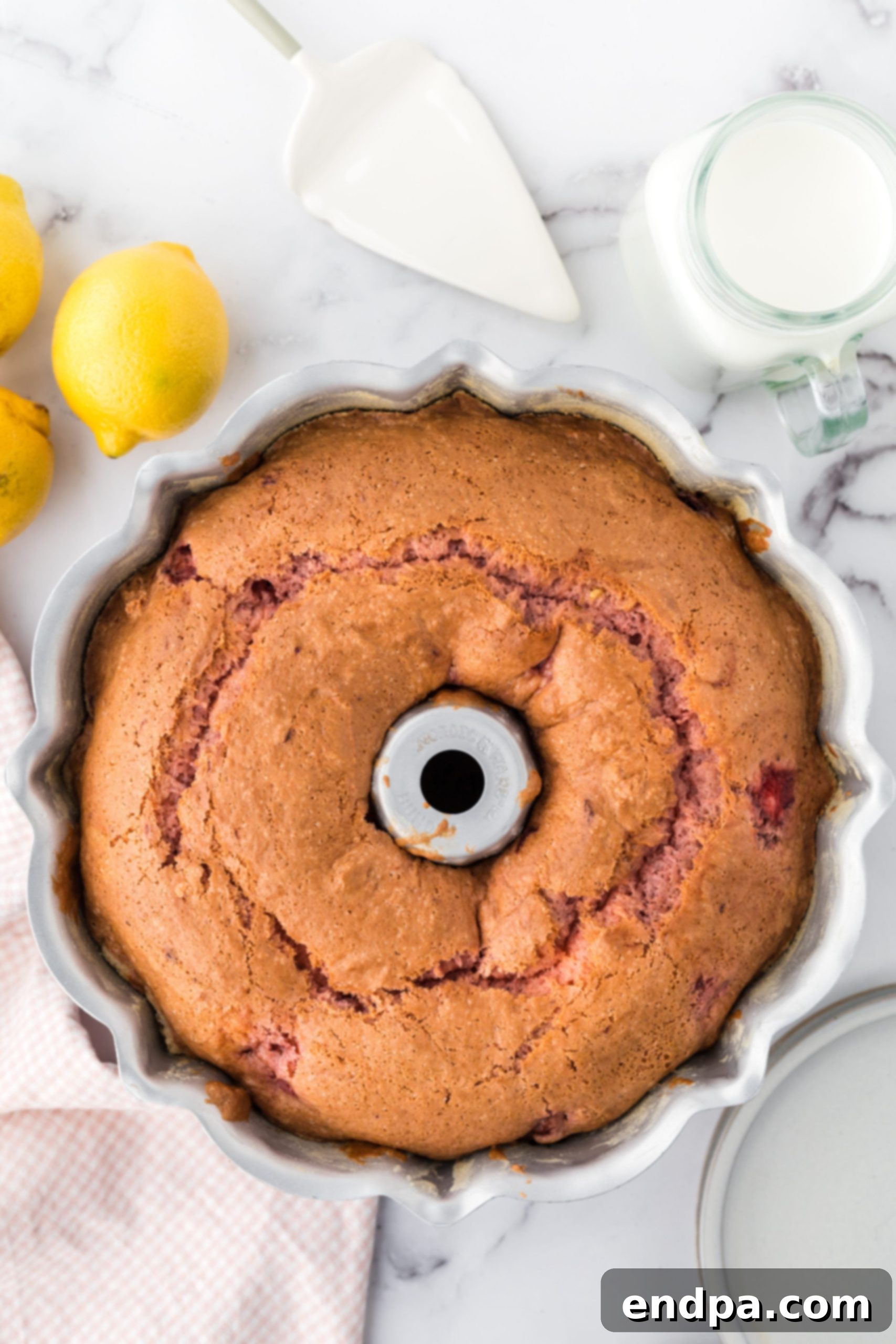 Zesty Strawberry Lemon Bundt Delight 8 Cake baked in pan.