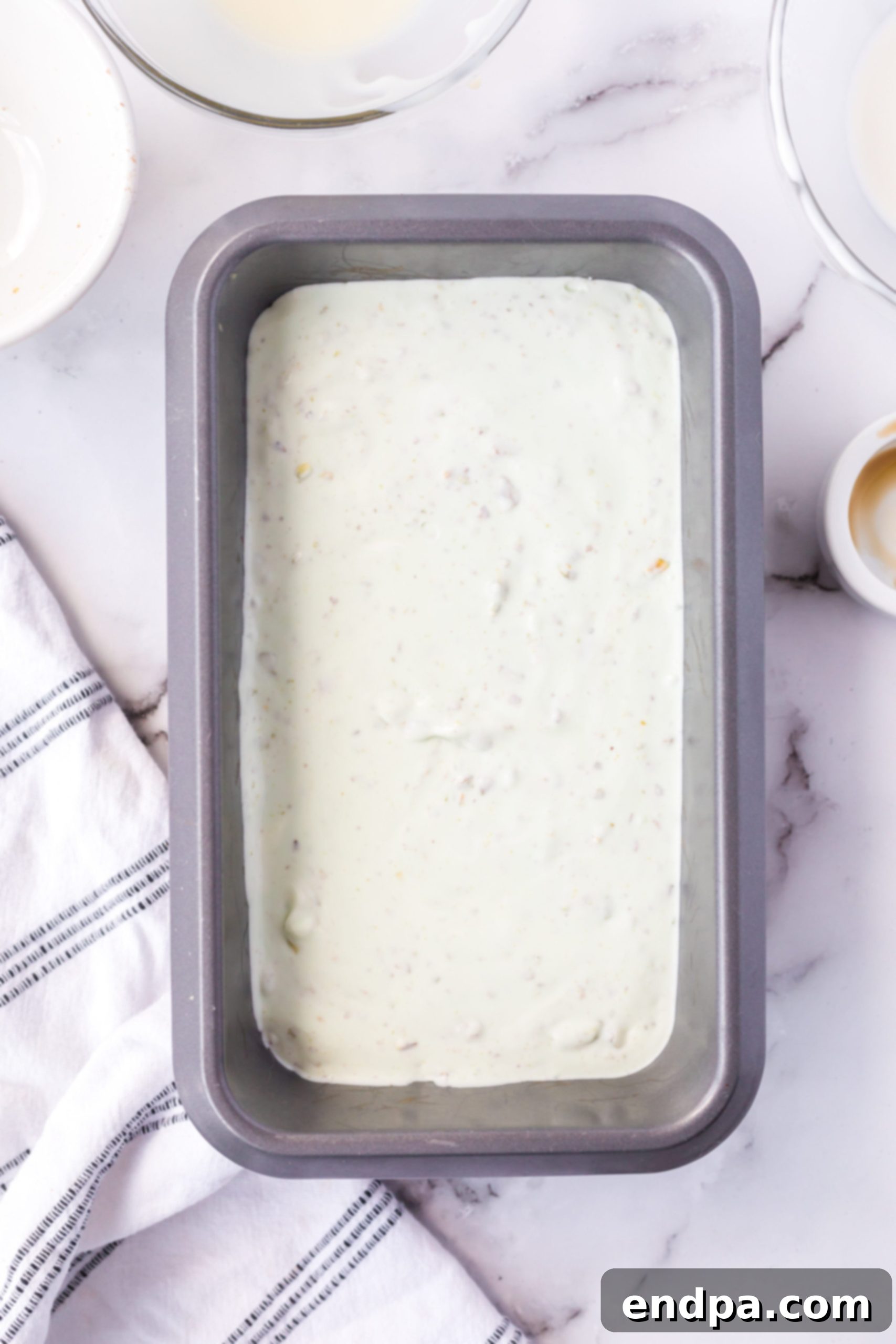 Emerald Dream Ice Cream 7 Mixture poured into loaf pan.