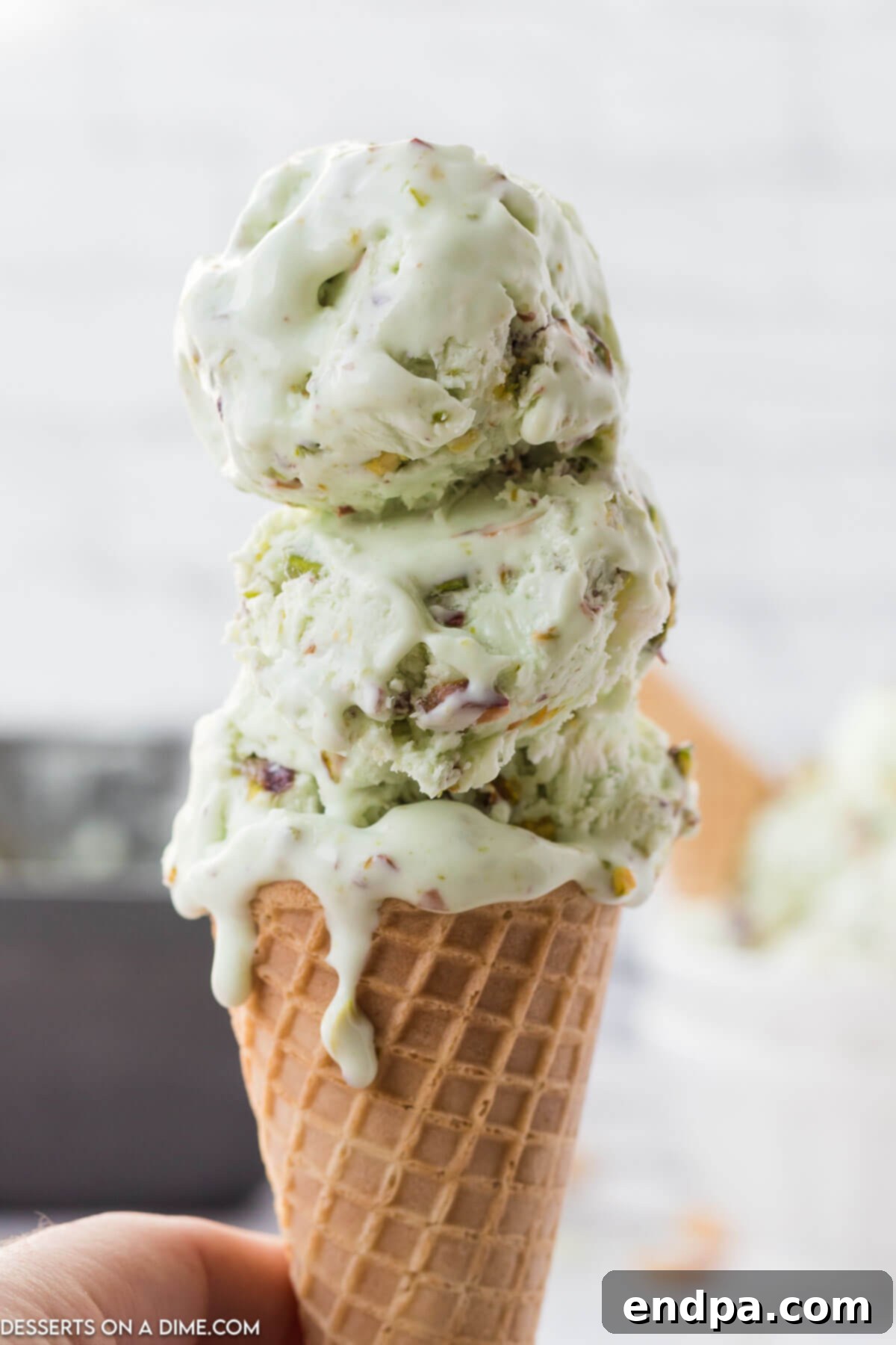 Emerald Dream Ice Cream 8 Pistachio Ice cream in a cone.