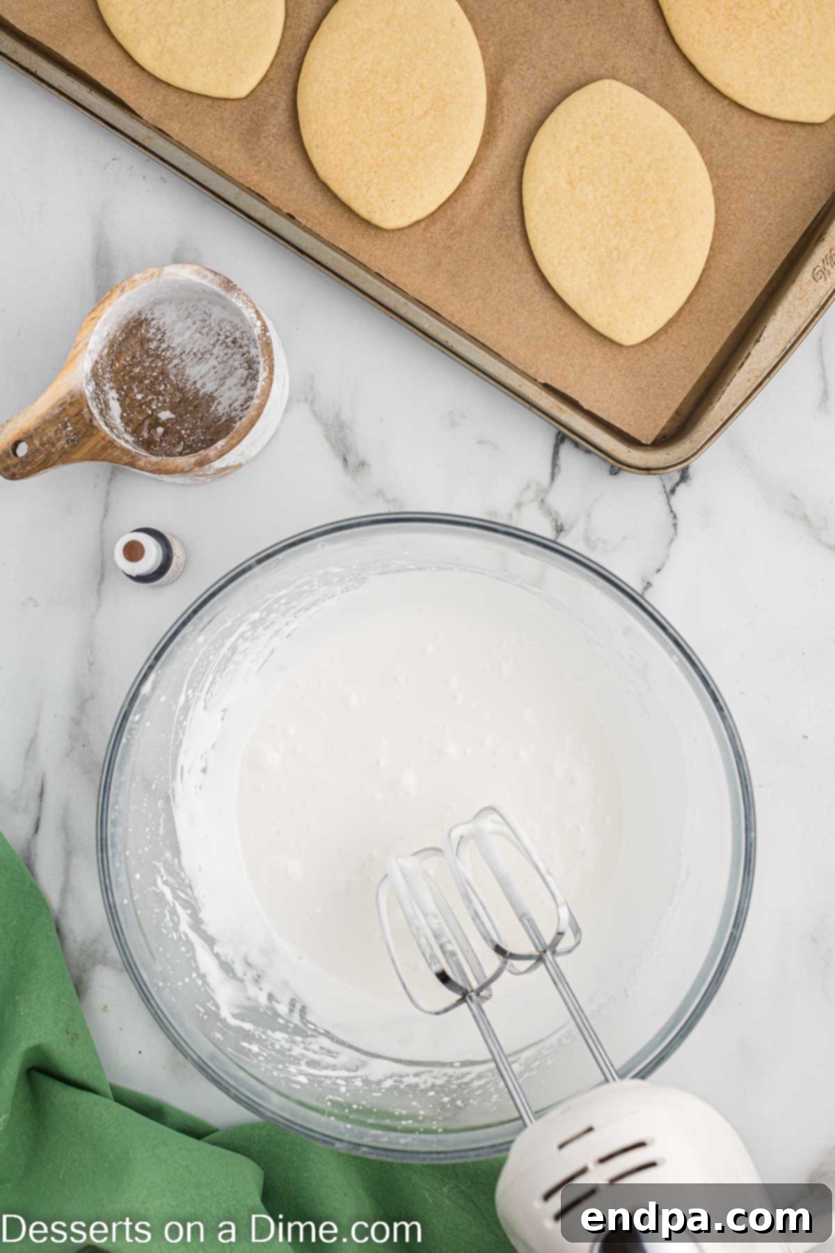 Touchdown Sugar Cookies 11 A mixing bowl containing white royal icing being prepared, ready for coloring and piping.