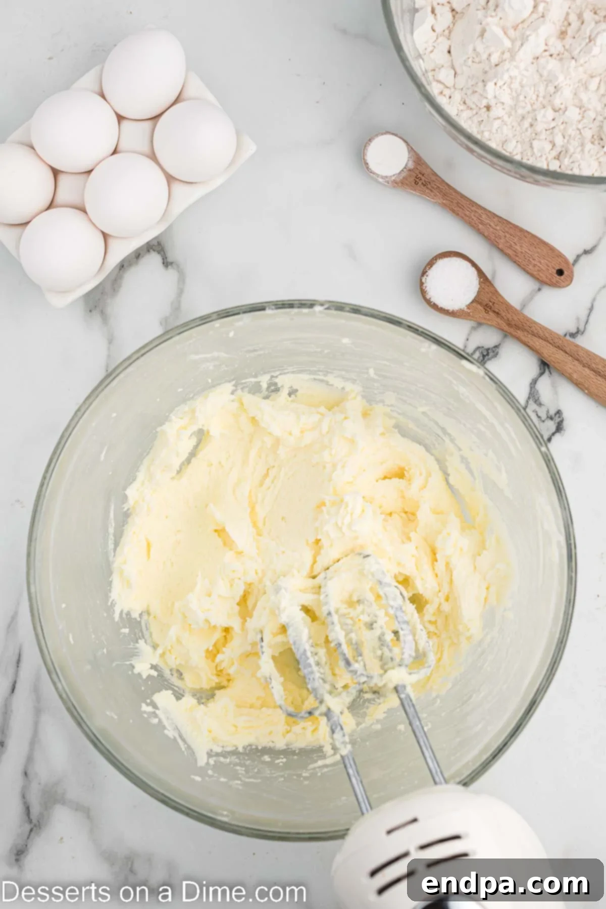 Touchdown Sugar Cookies 5 Mixing bowl with softened butter and granulated sugar being creamed together.