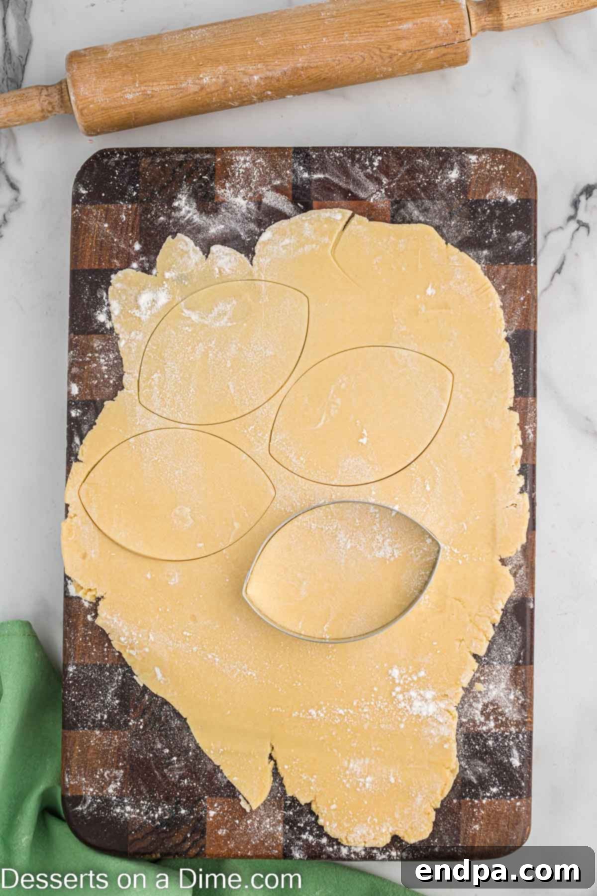 Touchdown Sugar Cookies 9 Chilled cookie dough rolled out thinly and cut into football shapes using a cookie cutter.