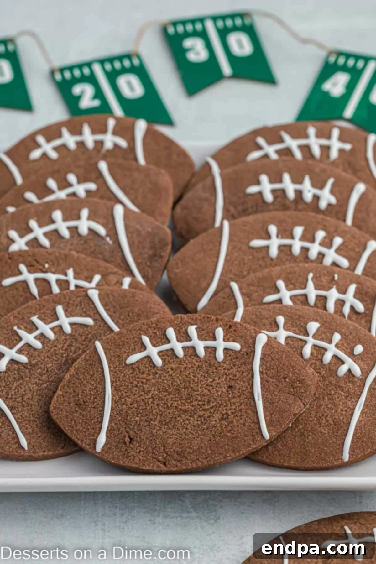 Championship Chocolate Football Cookies 12 A festive platter filled with decorated Chocolate Football Cookies, ready for a game day celebration.