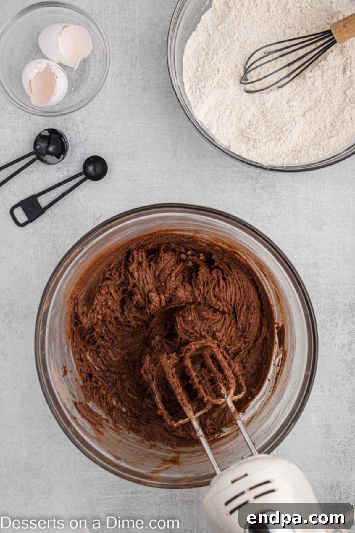 Championship Chocolate Football Cookies 5 Creamed butter and sugar mixture in a bowl, light and fluffy, ready for wet ingredients.