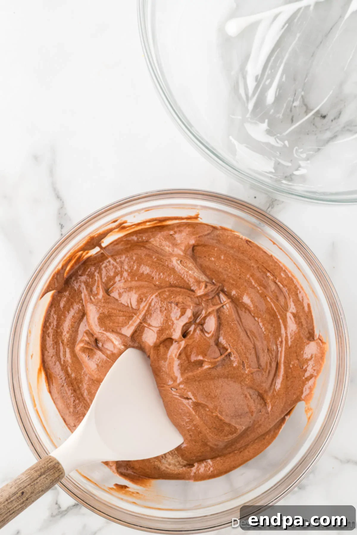 Velvety Chocolate Bliss 13 A perfectly combined chocolate mousse base with egg whites gently folded in, maintaining its airy volume.