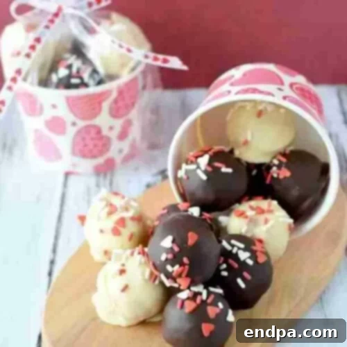 Love Baked Delights 5 Valentine's Day Cake Balls dipped in chocolate and sprinkles.