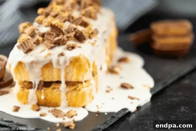 Love Baked Delights 8 Chocolate Peanut Butter Cake with frosting and peanut butter cups.