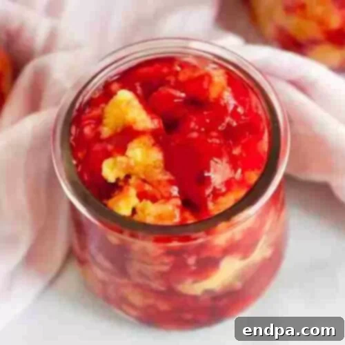 Love Baked Delights 12 Crock Pot Cherry Dump Cake with a scoop of ice cream.