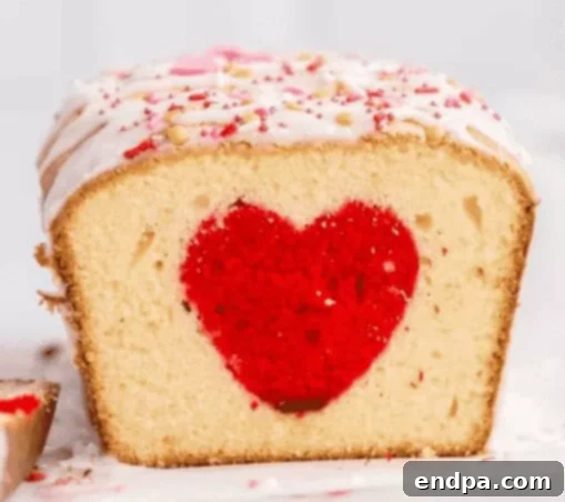 Love Baked Delights 21 Valentine’s Heart Cake slice showing a heart shape in the middle.
