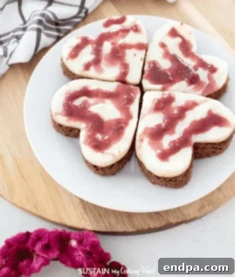 Love Baked Delights 29 Mini Heart Cakes with pink frosting.