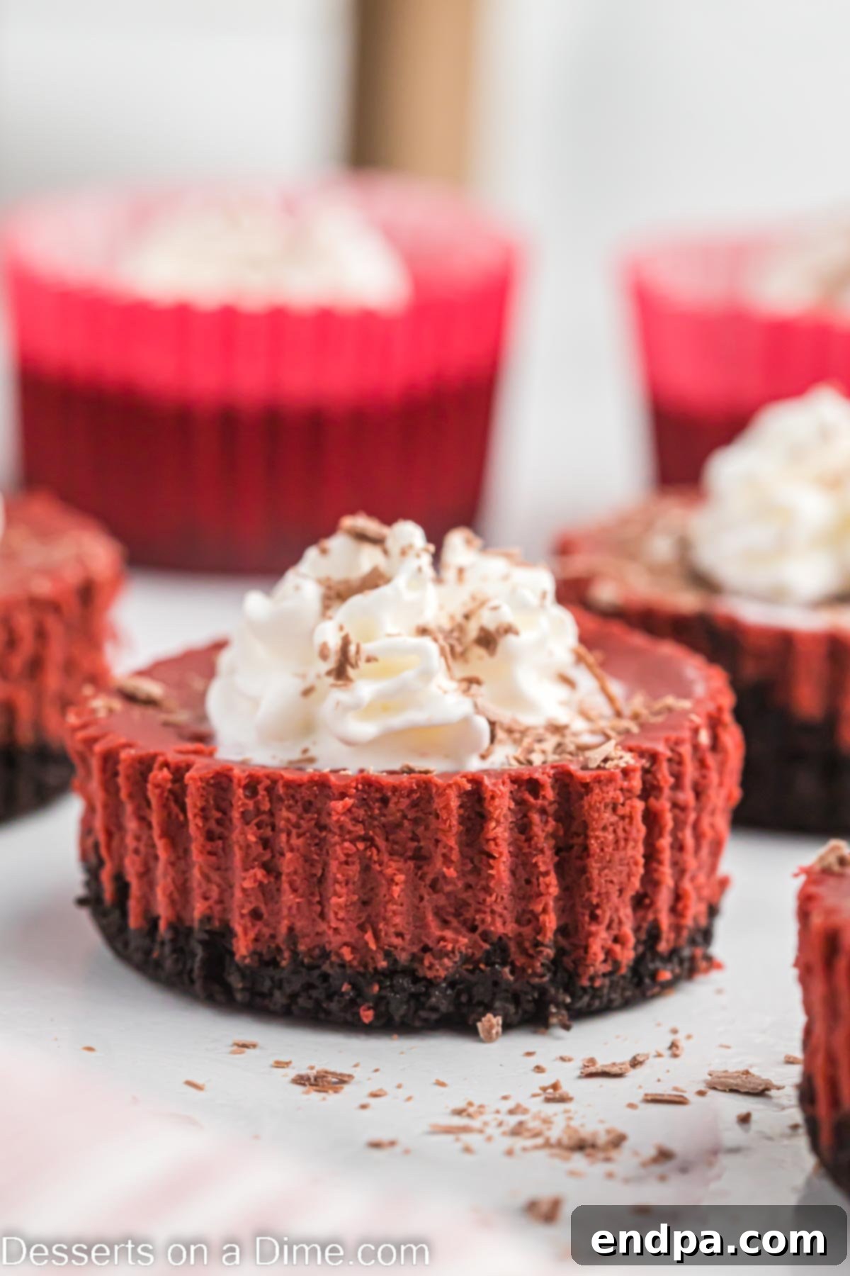 Petite Red Velvet Cheesecakes 2 Mini red velvet cheesecake ready to serve.