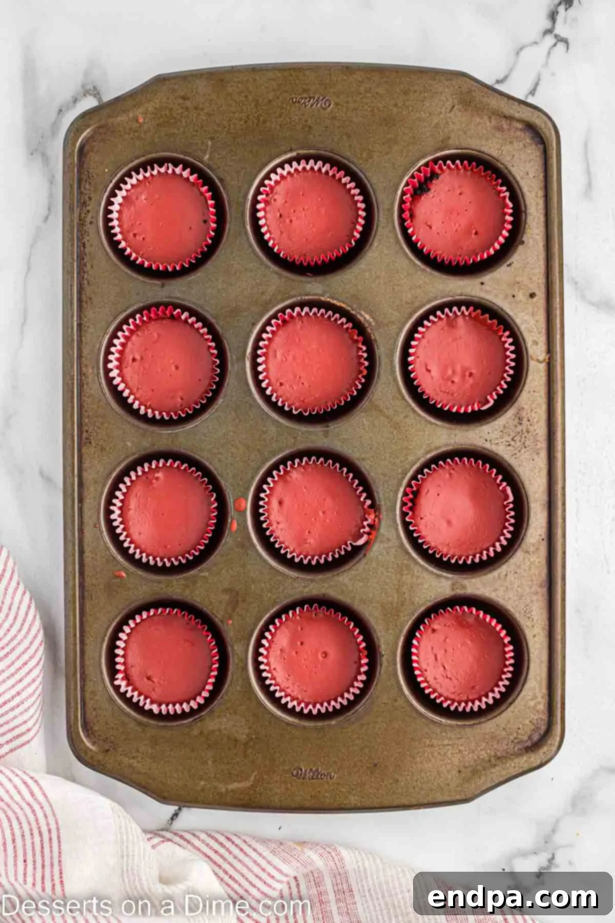 Petite Red Velvet Cheesecakes 8 Cheesecake baked and cooling in pan.