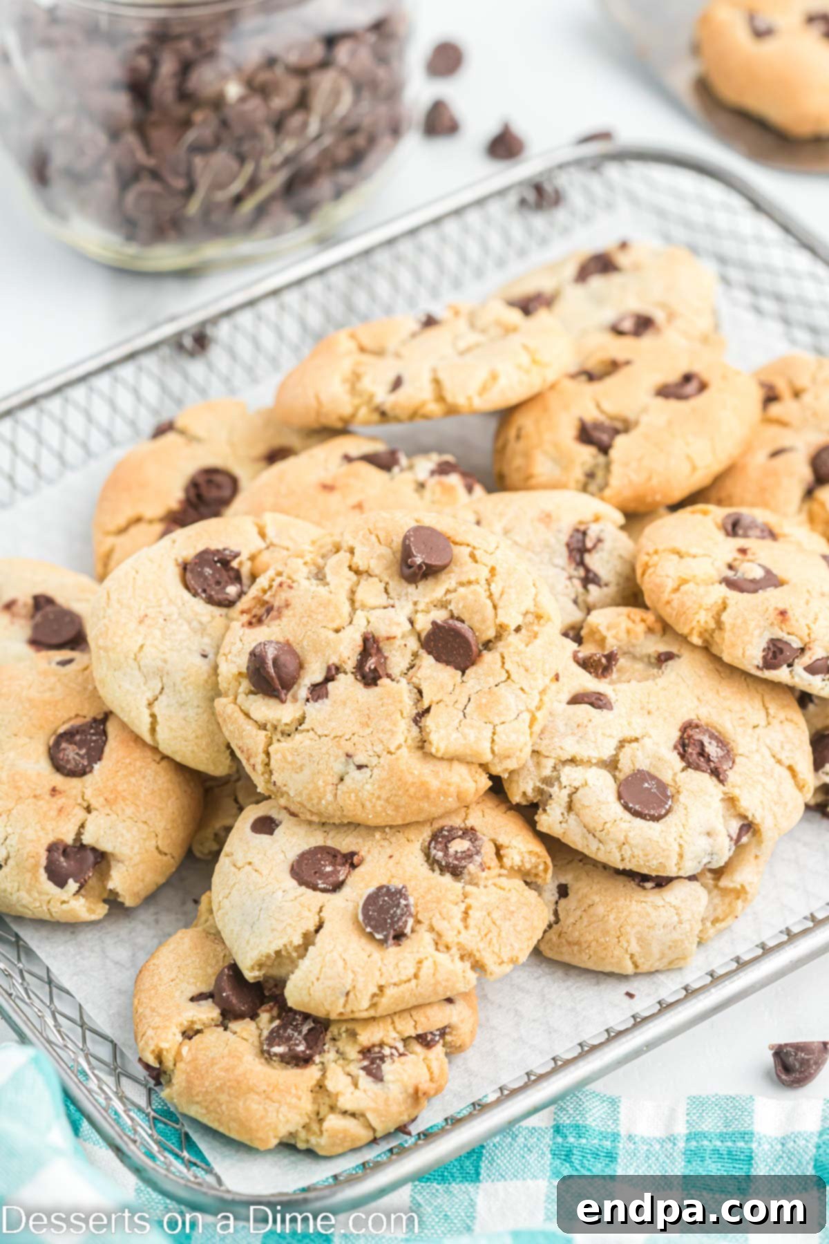 A stack of perfectly baked air fryer chocolate chip cookies with melted chocolate chips, ready to be served or stored.