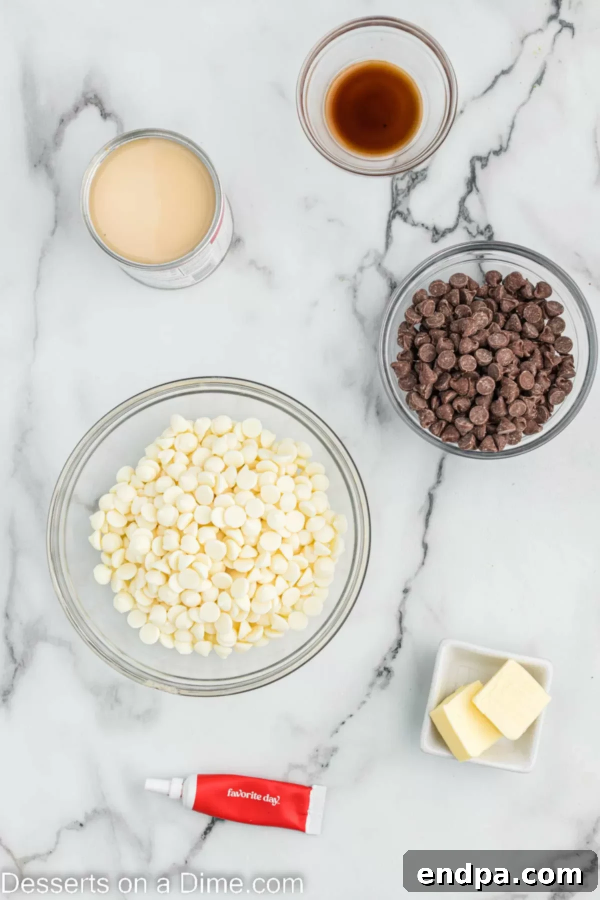 Assortment of key ingredients for Red Velvet Fudge, including white chocolate chips, sweetened condensed milk, butter, vanilla extract, and red food coloring.